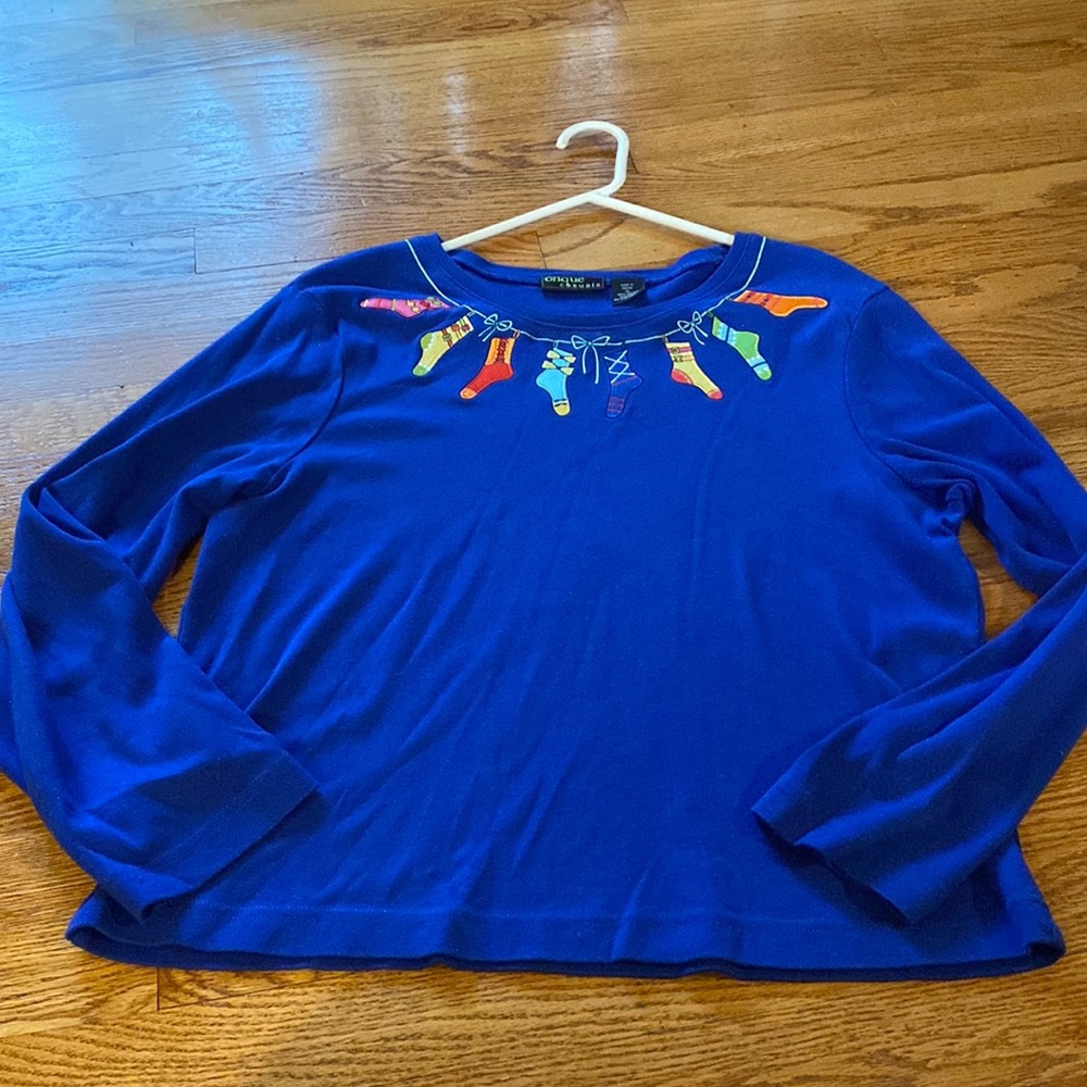 XL Onque Casuals holiday shirt with Christmas stockings around the neckline.